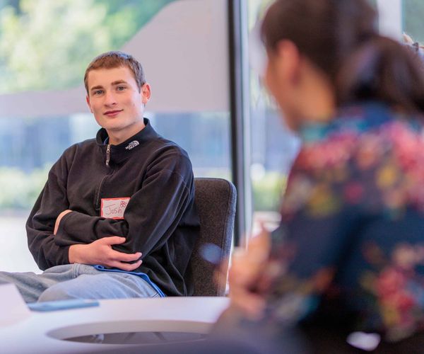 A student talking with a mentor