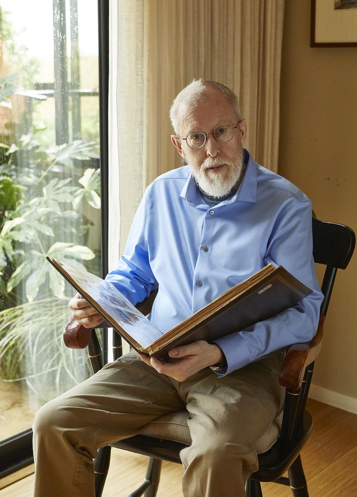 Bill Garn, Blanche Crozier's grandson, with the scrapbook his mother created