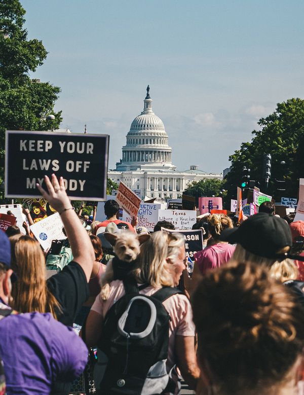 A large group of reproductive rights protestors approach the US Capitol building