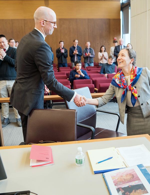 Ian Gillen (´19) and Alexandra Arnold (´19) shake hands after completing their oral arguments.