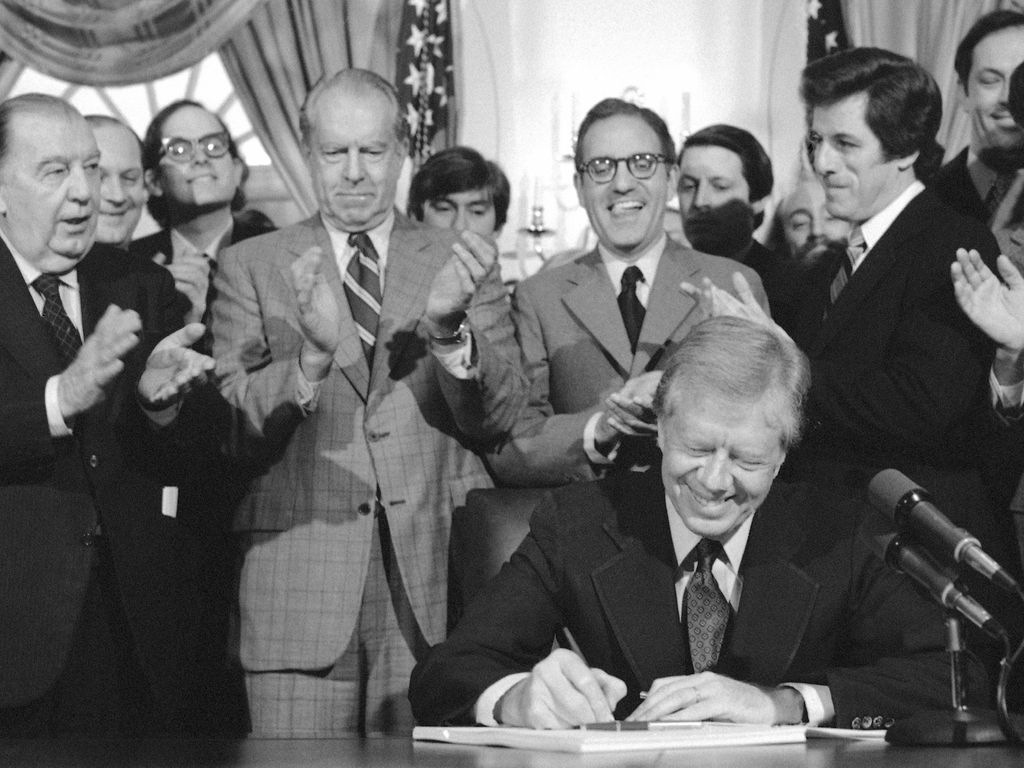 Robert Stafford (fourth from the left) was present when President Jimmy Carter signed the Comprehensive Environmental Response, Compensation, and Liability Act