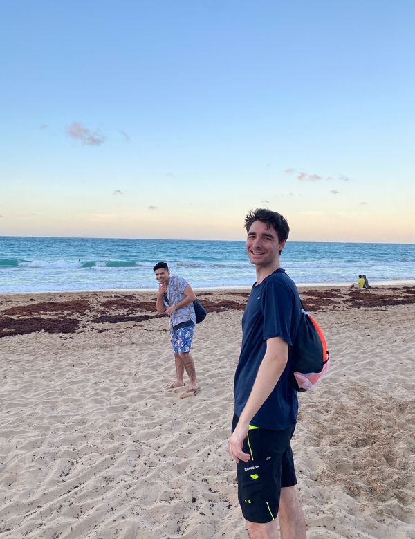 Matthew Ierardi (right) and Alejandro Perez (left) on a beach in Puerto Rico.