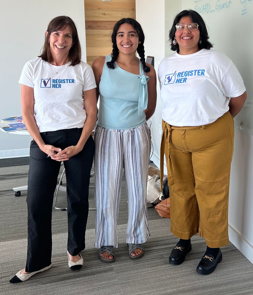 Rachel Jeck with two of Register Her's organizers.