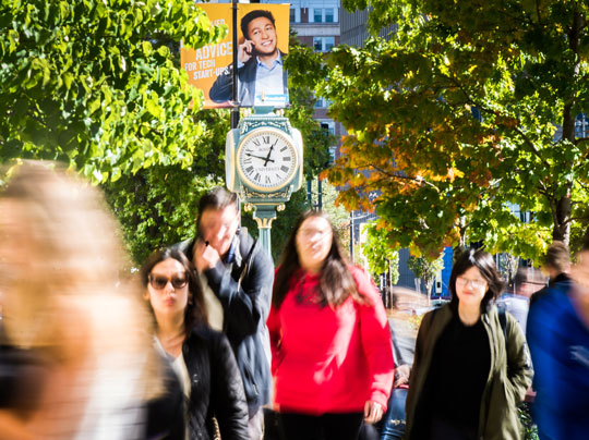 Students walking around the Charles River campus on Commonwealth Avenue in Boston.