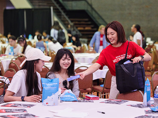 A professor engaged in a class - contact an Admissions Advisor to learn more about BU MET.