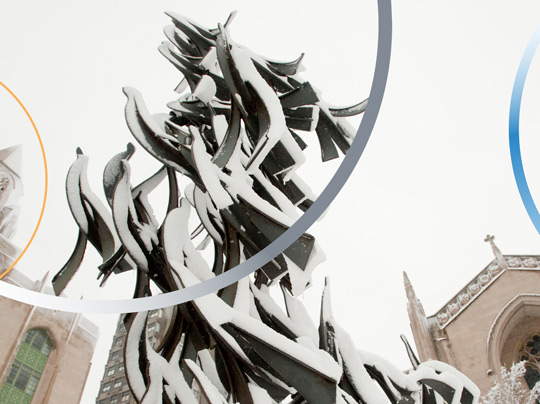 The sculpture “Free at Last” by Sergio Castillo in Marsh Plaza, covered in snow