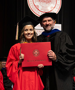 Raina Cordell (MET’23) receives her diploma from Boston University.