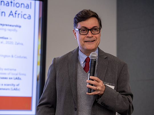 Associate Professor of the Practice Marcus Goncalves presenting at a conference