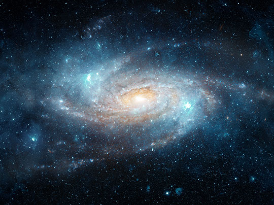 Rendering of space, filled with stars and a galaxy in the distance