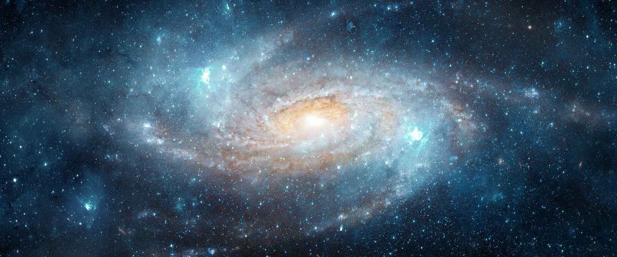 Rendering of space, filled with stars and a galaxy in the distance