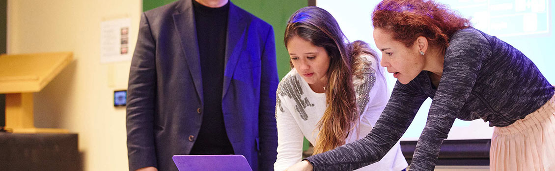 Two students in Dr. Zlatev's class at BU's MET College go over an assignment.