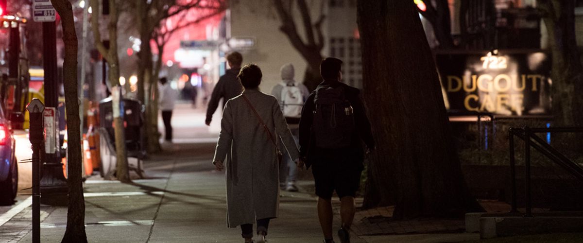 Two students walking on Commonwealth Avenue in the early morning hours. Photo by Cydney Scott
