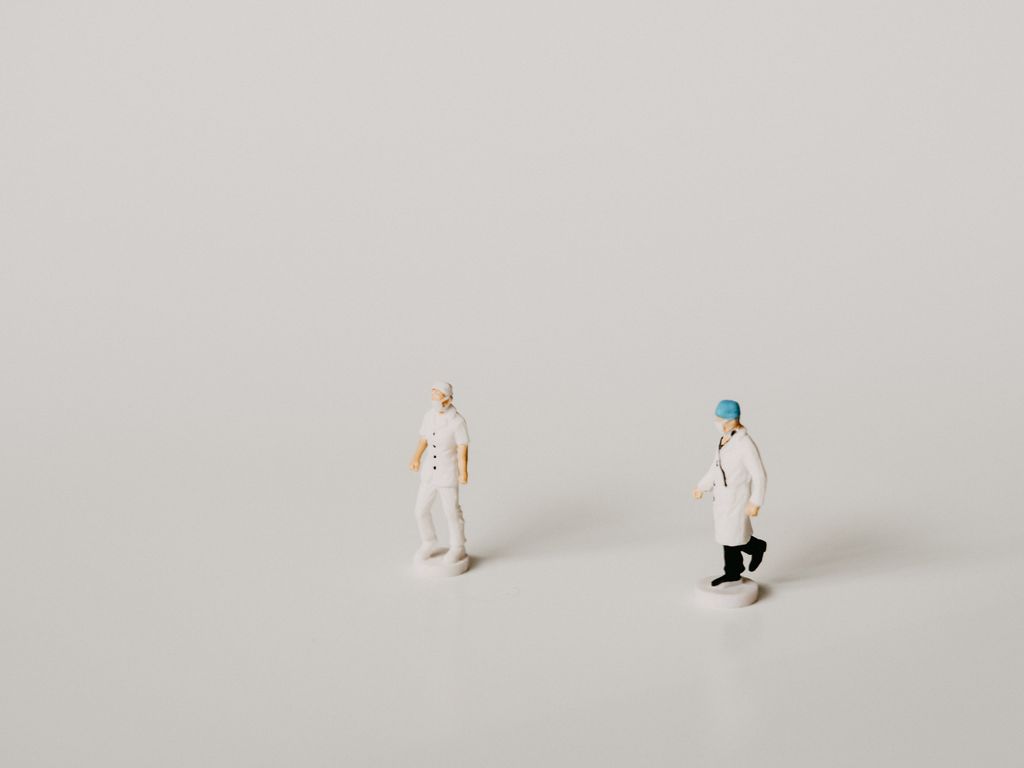 Figurines of doctor and nurse