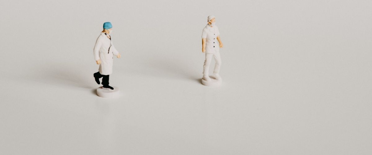 Figurines of doctor and nurse