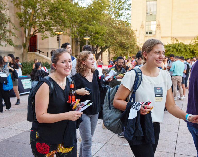 Admissions ambassadors walking on campus