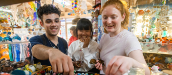 Alternative Spring Break student enjoy themselves in a gift shop after volunteering all day