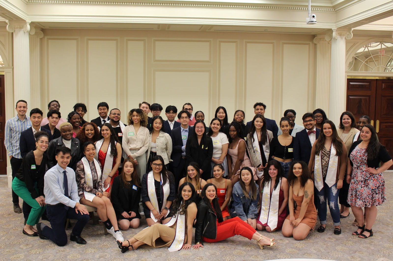 A group of around 30 Ascend Fellowship students pose in smart attire.