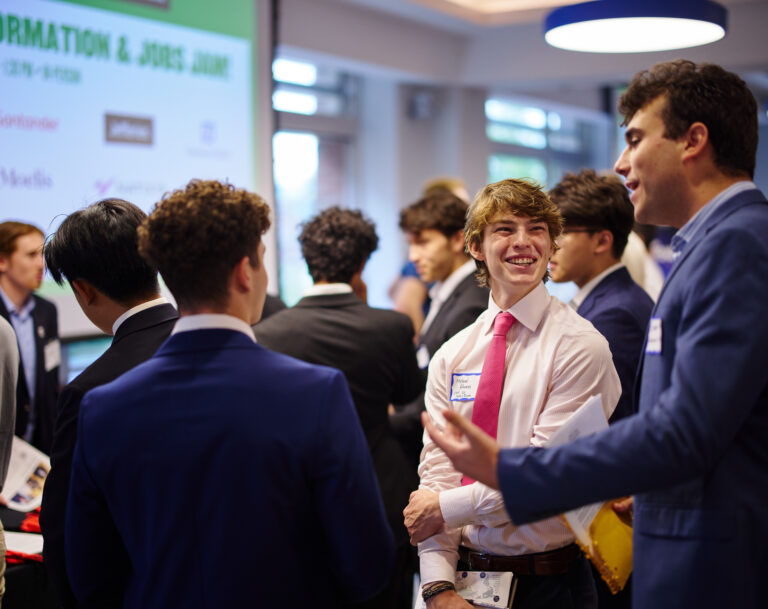 Smiling student mingling at a career event