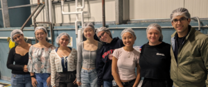 students visit a companies facilities as part of a course