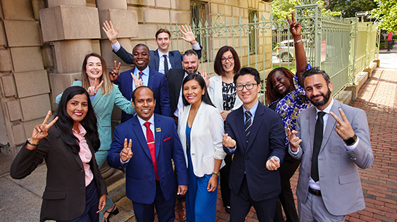 Diverse group of professionals posing for a photo