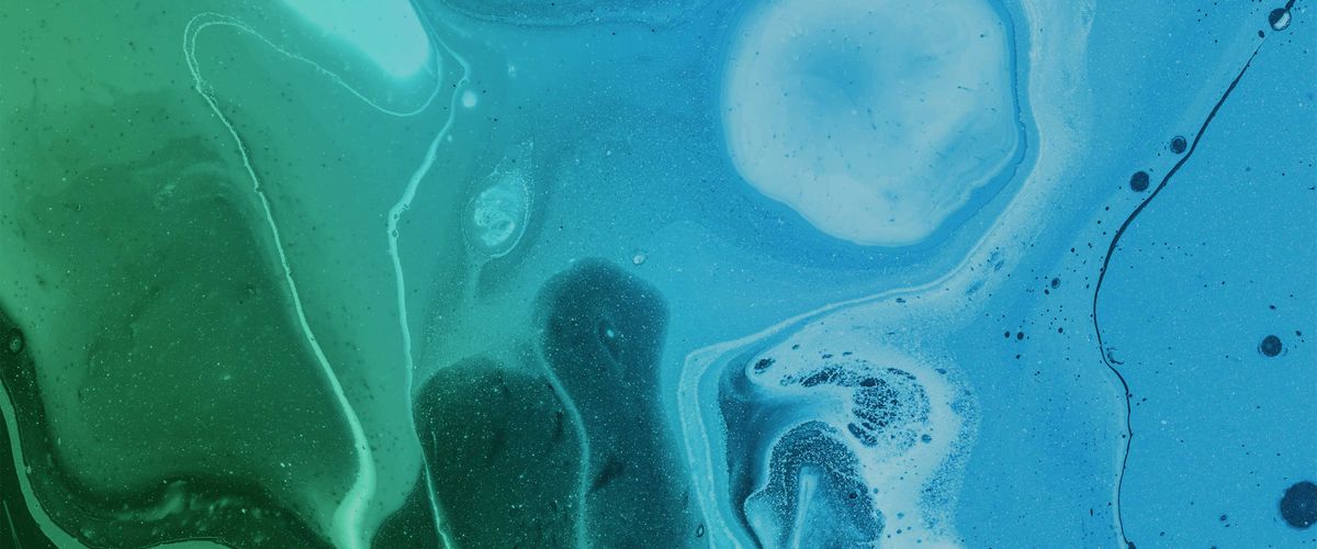An abstract image that looks like water with blue and green swirls