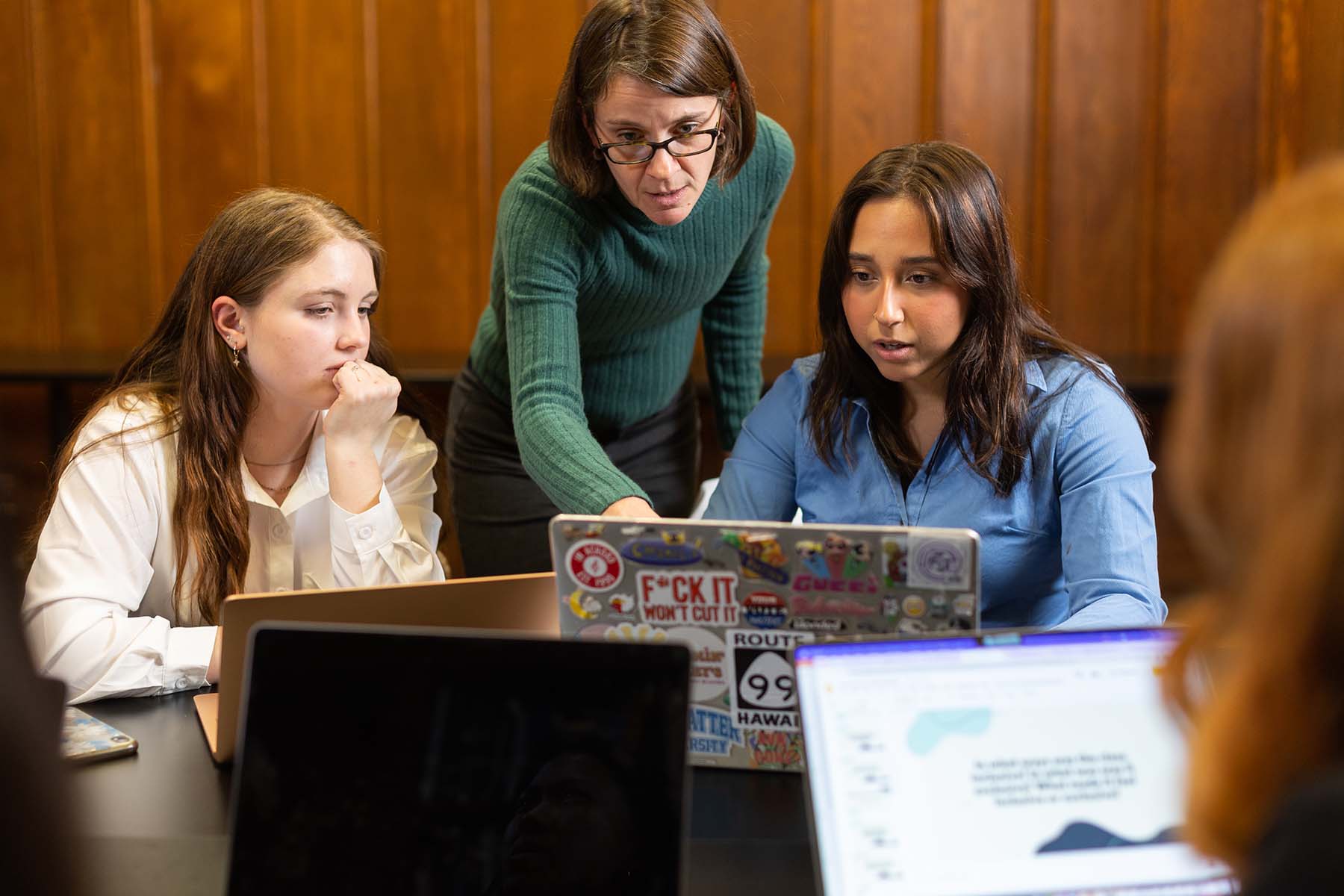 researchers looking at laptop