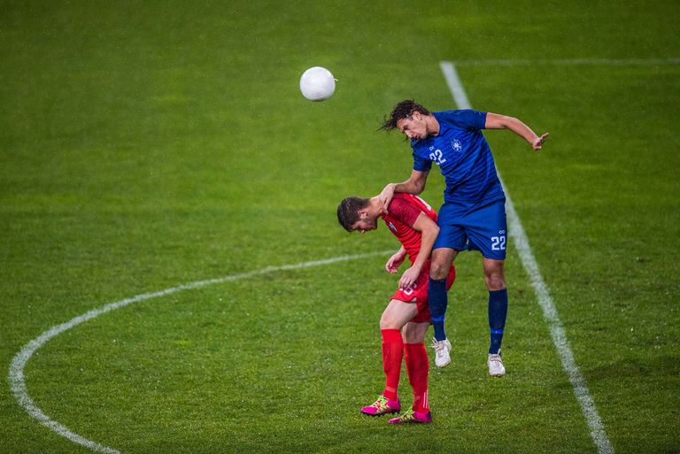 Soccer player hitting ball with head