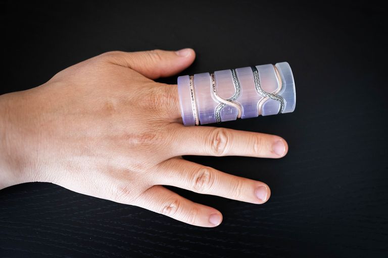 Human hand with medical device on pointer finger