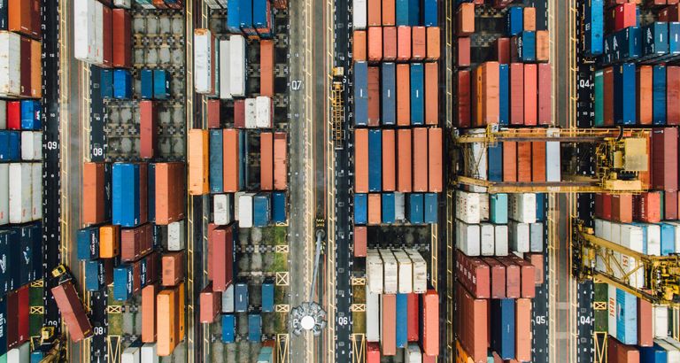 Assorted shipping containers in dock