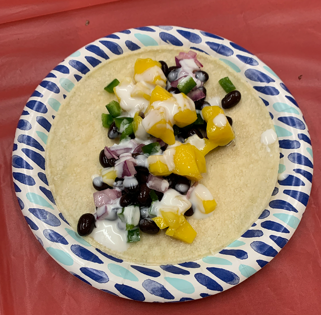 To display an assembled taco.