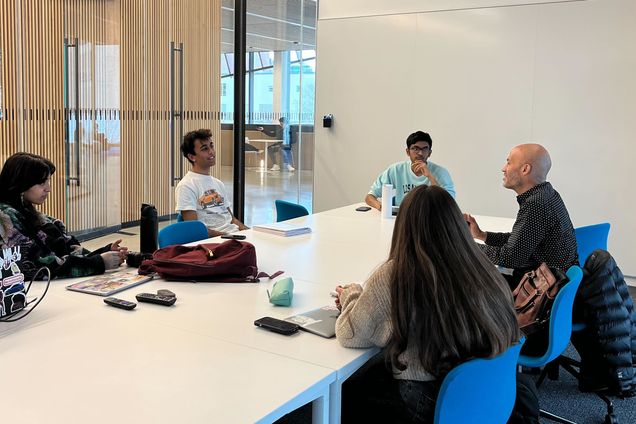 Spark! students meet with a mentor.