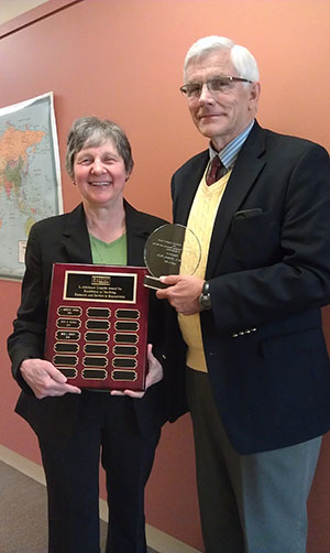 BUSPH Biostatistics Professor L. Adrienne Cupples presents David L. DeMets with the 2014 L. Adrienne Cupples Award for Excellence in Teaching, Research, and Service in Biostatistics.