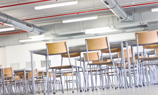 Chairs at tables in an empty room