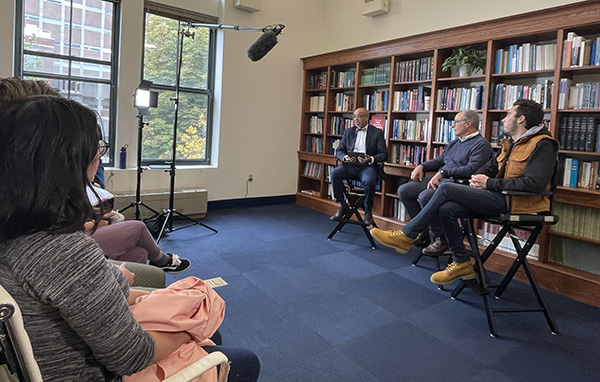 David Hogg and John Rosenthal talking with Dean Craig Andrade