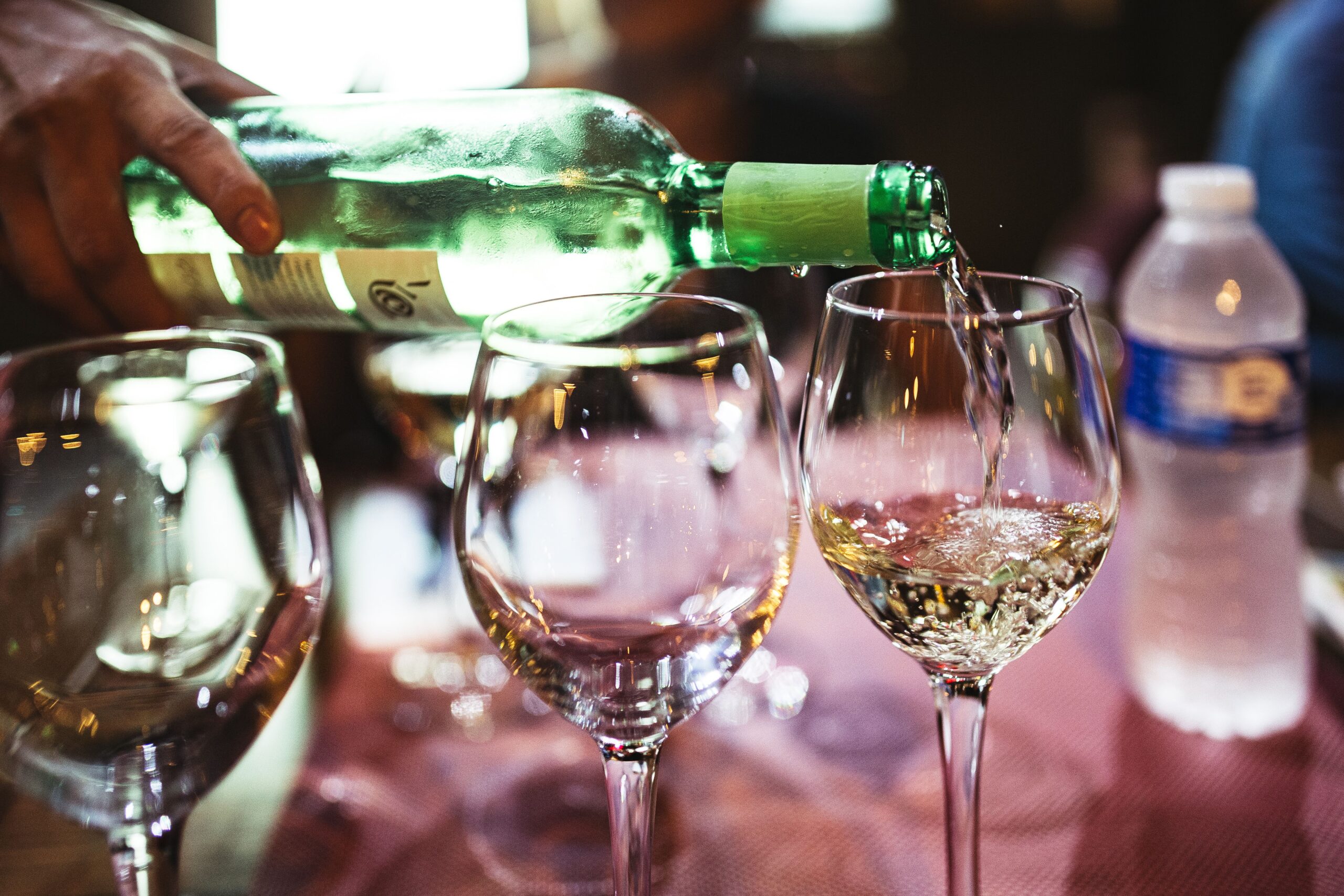 White wine being poured into a glass