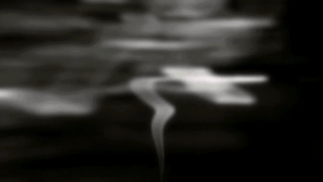 GIF of smoke rising from the lower center of screen