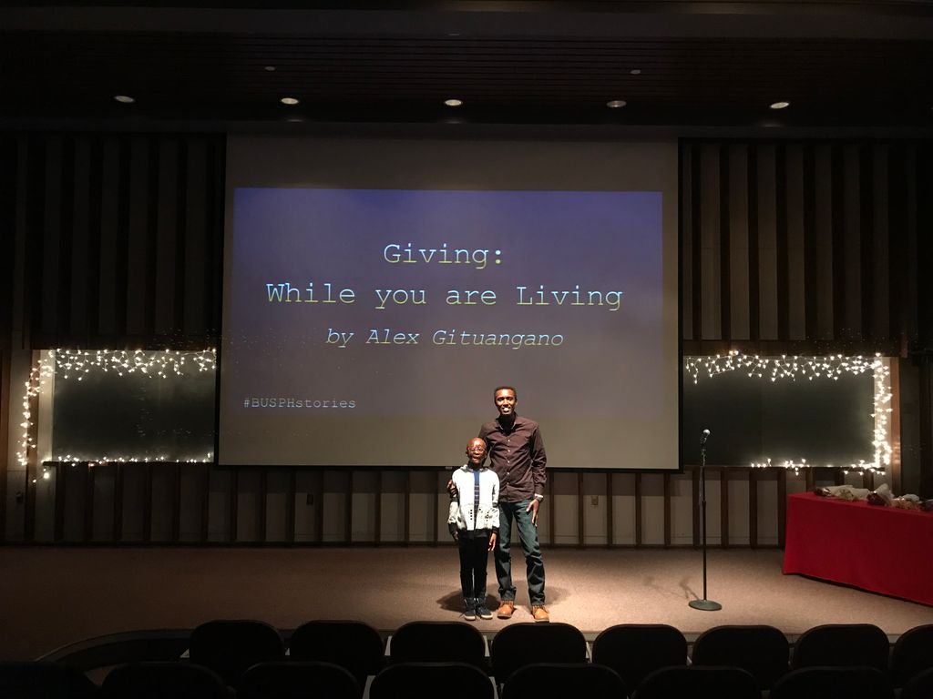 Alex and Leo stand on stage together after sharing their story with the BUSPH community in 2017