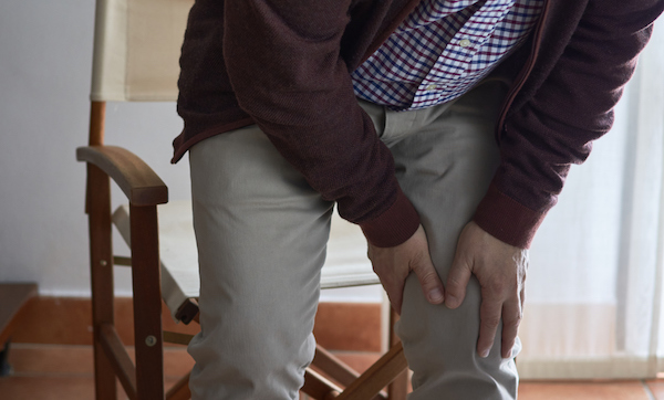 A middle-aged man has knee pain when he gets up from his seat. This man may have arthritis, rheumatism, osteoarthritis, or osteoporosis.