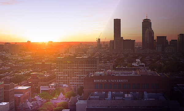 Boston skyline at sunset, BU campus visible in bottom right corner