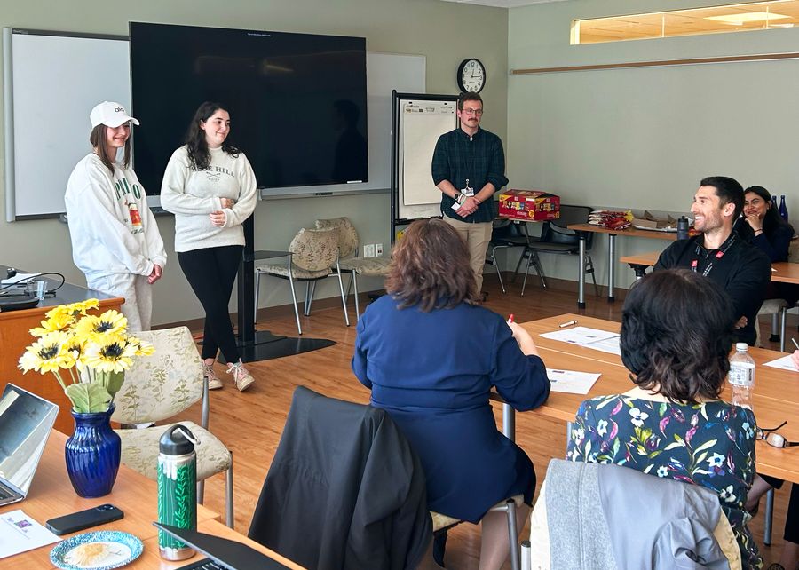 Team Sunflower presenting before a panel of BU wellbeing professionals