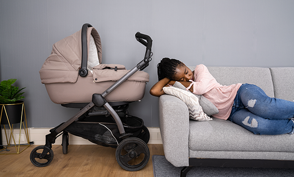 Sleepy-African-American-Woman-With-Newborn-600x362