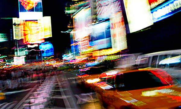 Random blurry image of billboards and lights at night