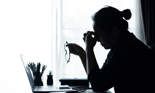 Businesswoman faced challenging problem at office, navigating work stress and using her computer to find solutions amidst feelings of depression. problem, woman, job, business, stress, depression.