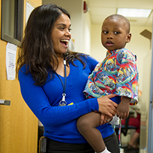 a field education student smiles at child 