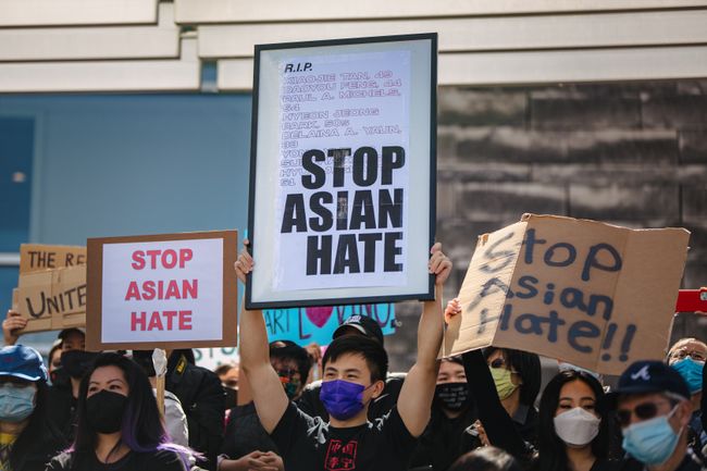 sings saying stop asian hate