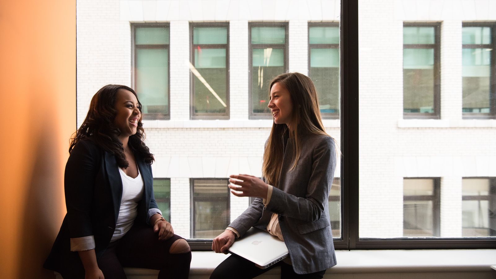 two business partners converse