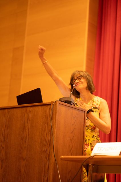 Prof. Belkin Martinez raising a fist in solidarity.