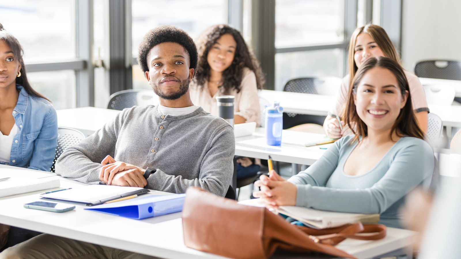 a group of students listening in class