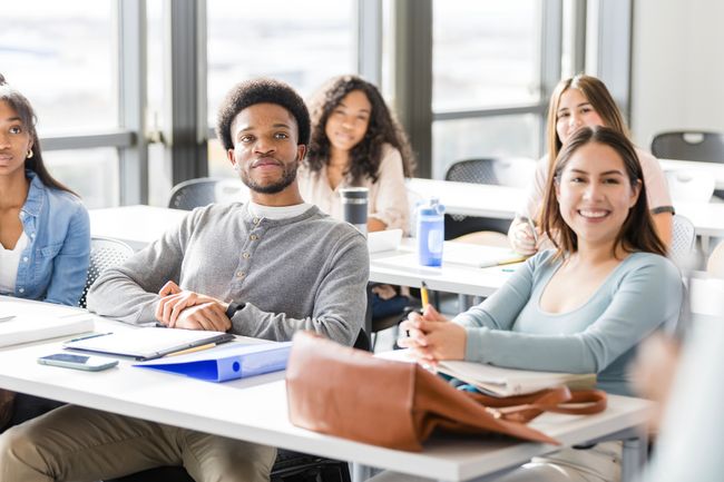 a group of students listening in class