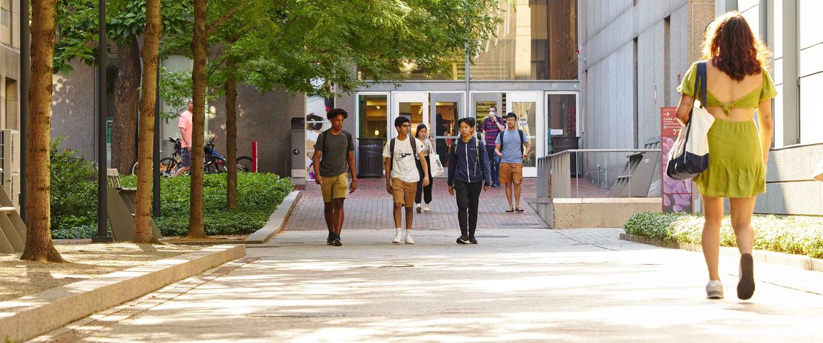 Boston University students strolling across the campus